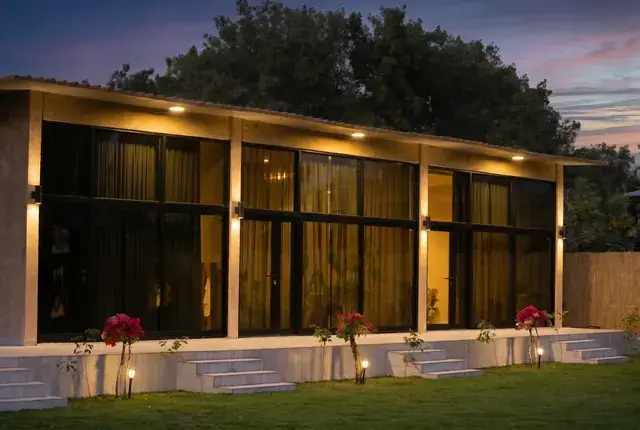 Glass pavilion lit at night